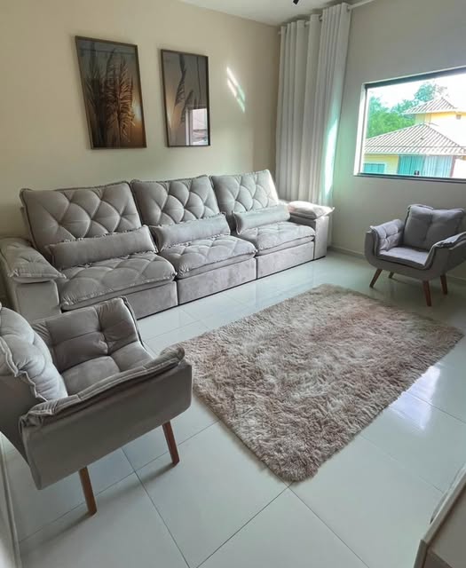 Sala de estar com sofá e poltronas Unique